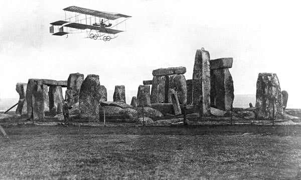 Postcard showing a Bristol Boxkite flying over Stonehenge on Salisbury Plain.